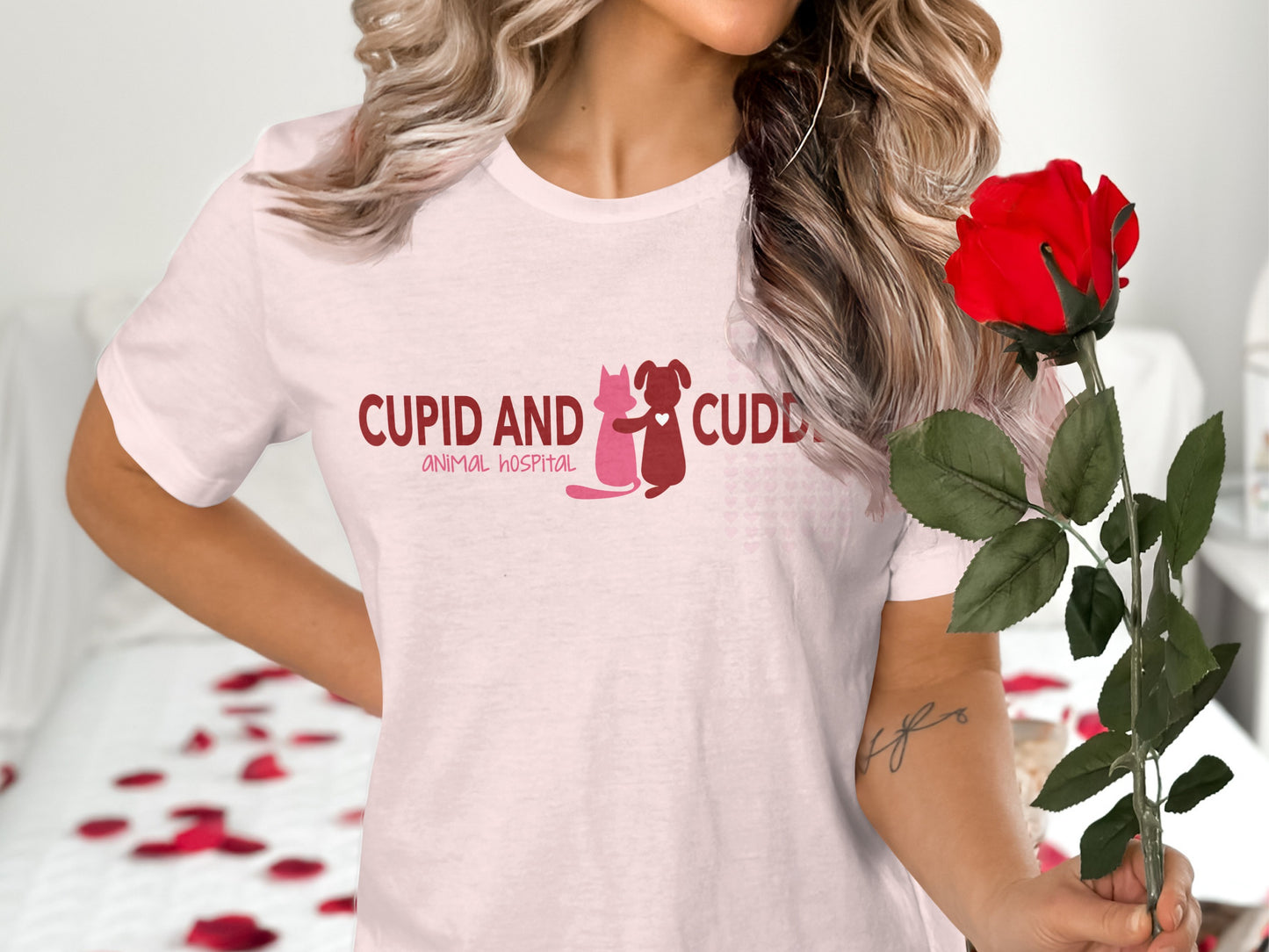 Pink t-shirt with "CUPID AND CUDD ANIMAL HOSPITAL" text and cat and dog silhouette.